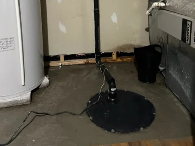 Solution for Water Infiltration in the Basement with a Sump Pump in Sainte-Eustache. After Solution for Water Infiltration in the Basement with a Sump Pump in Sainte-Eustache. After
